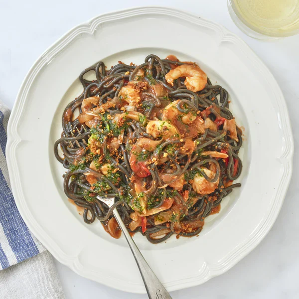 Spaghetti Nero with Prawns, Pangrattato & Herb Oil